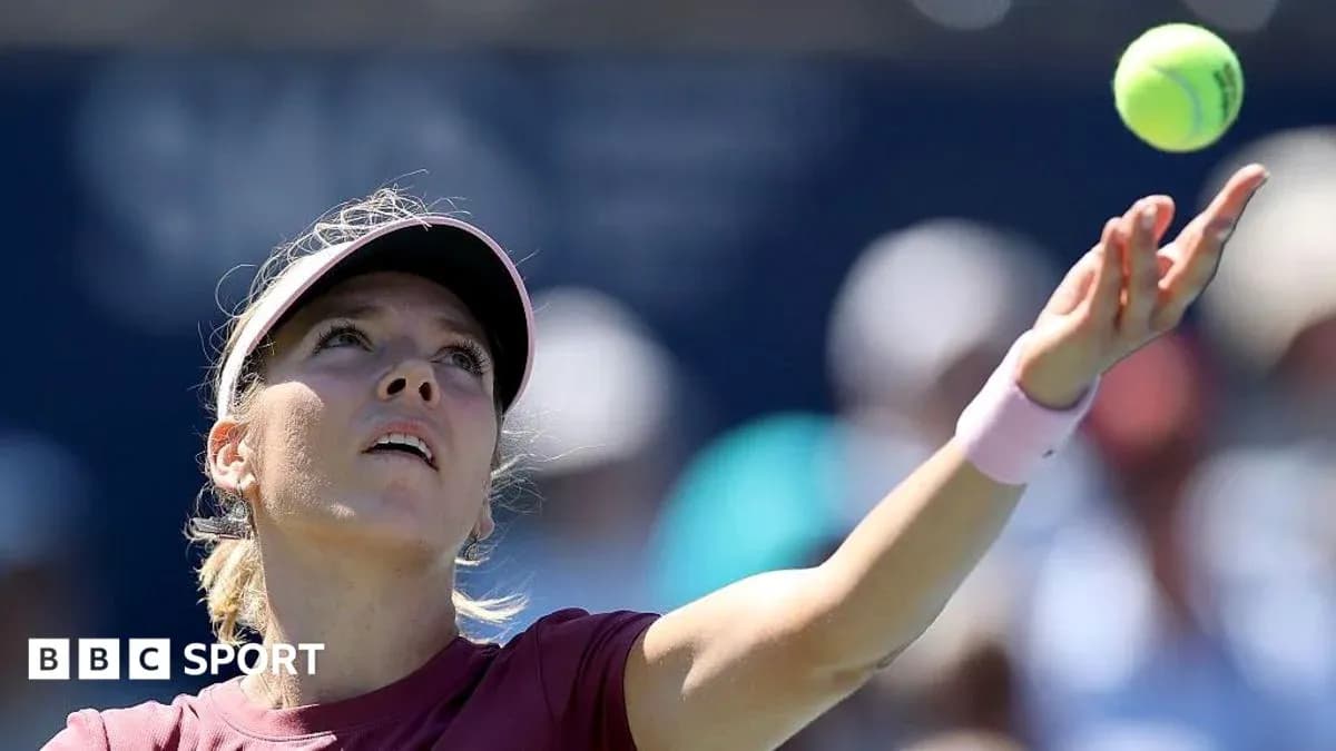 Female player serving during a tennis match