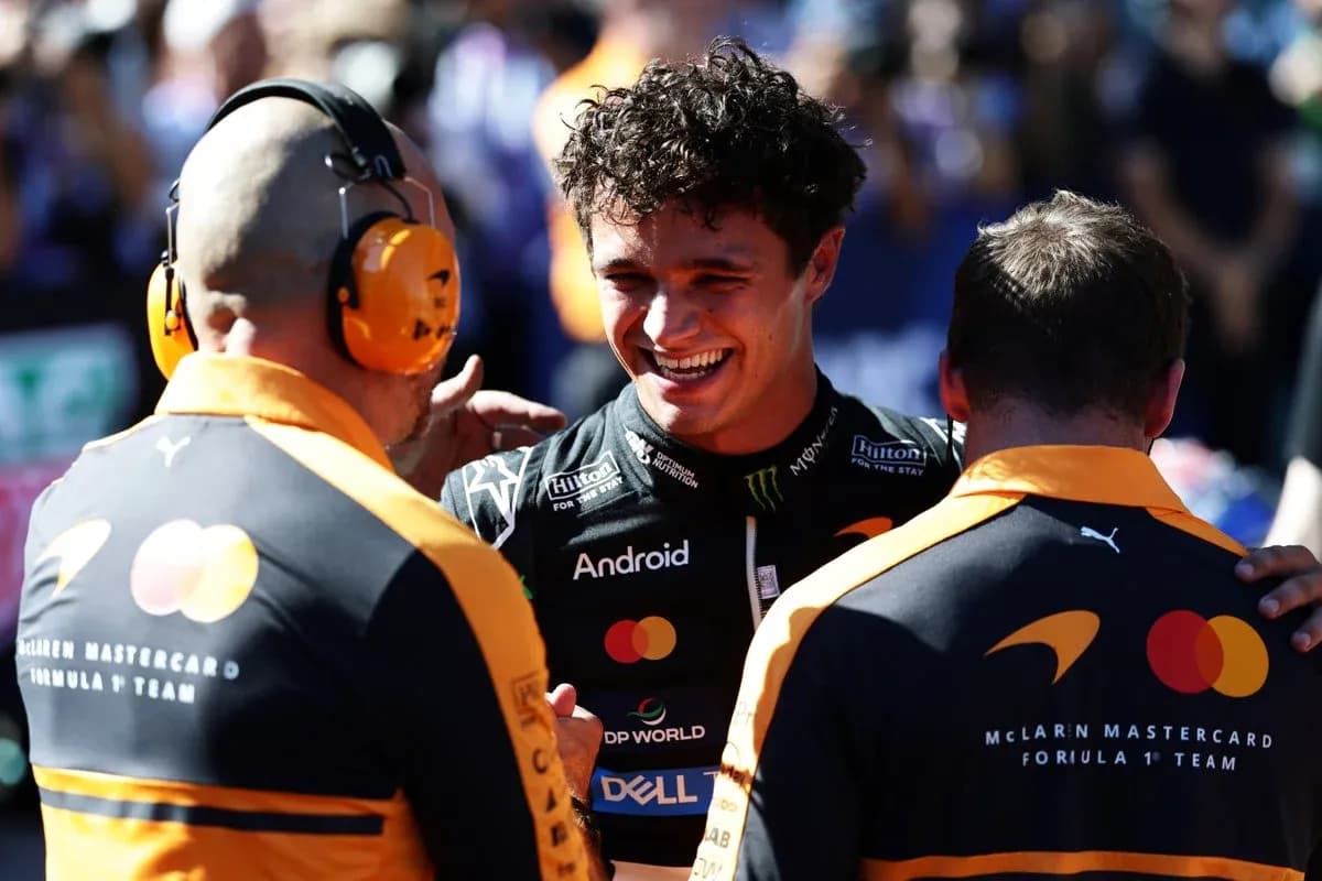 Lando Norris celebrating with McLaren team members