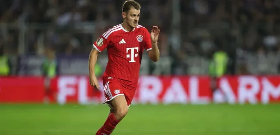 Player in red jersey running on the field