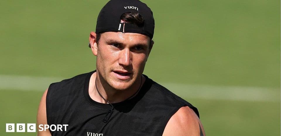 Athlete training on field in black attire