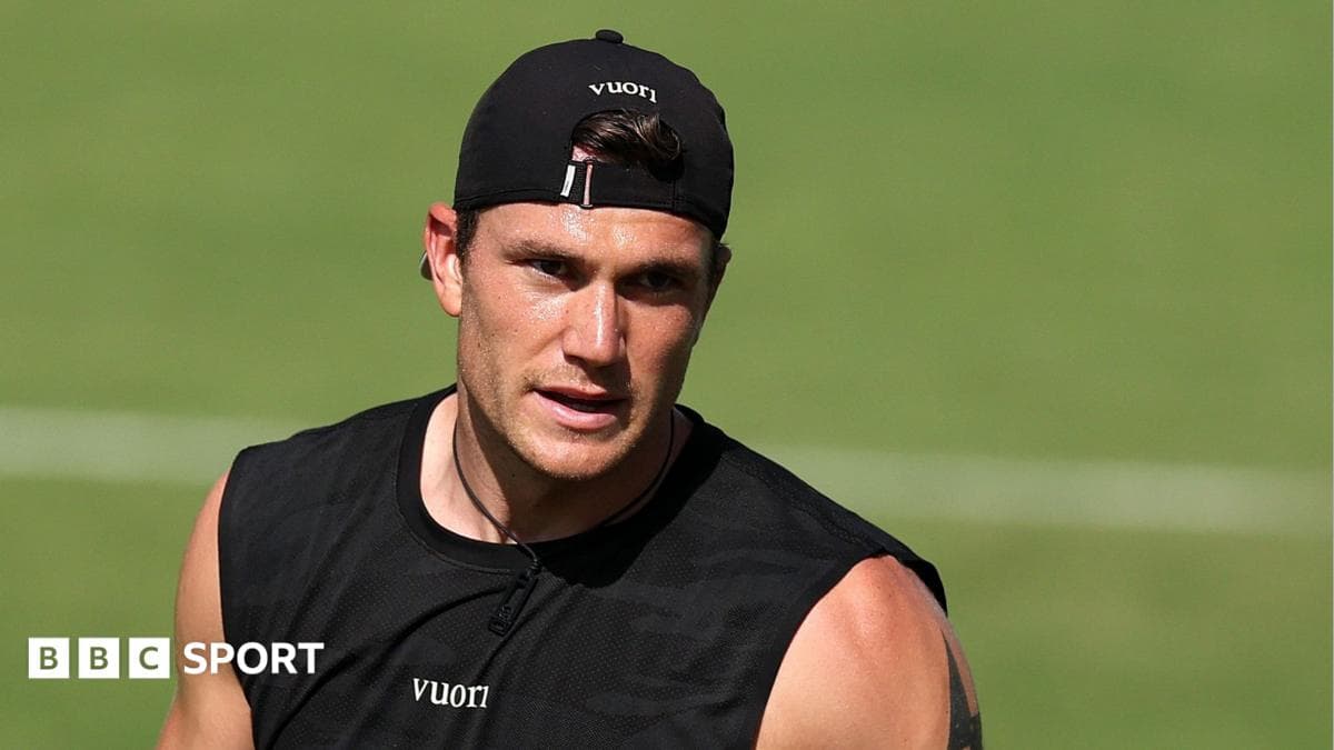 Athlete training on field in black attire