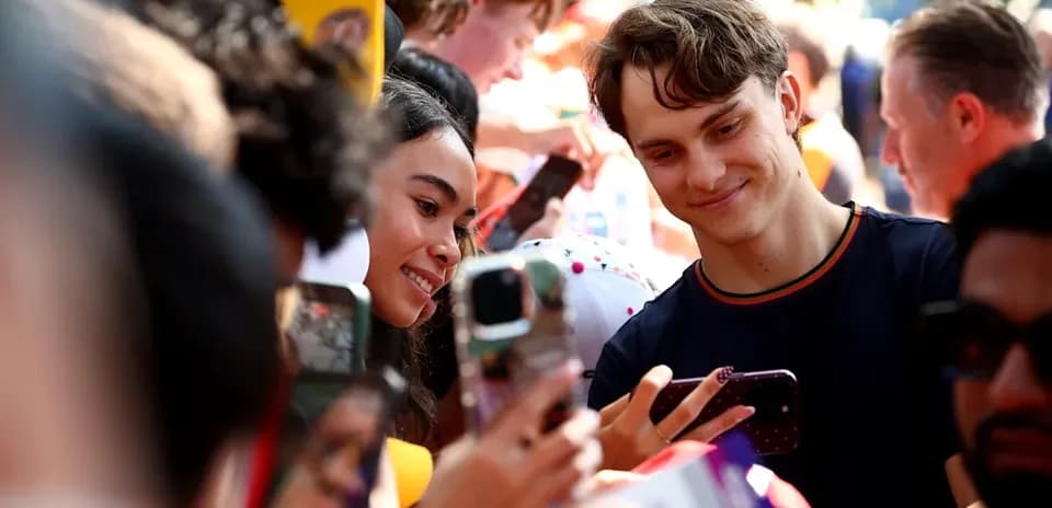 Two fans taking a selfie at an event