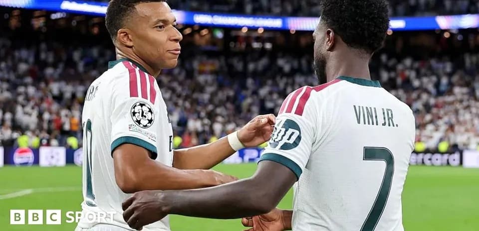 Mbappé and Viní Jr. celebrating on the field