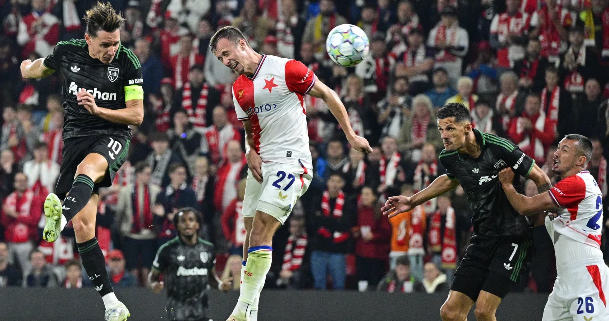 Players competing for the ball during intense match action