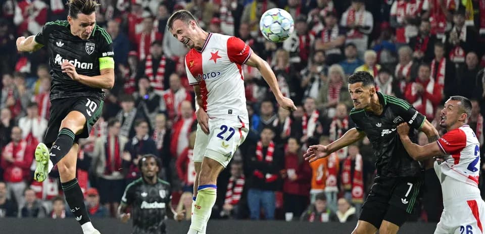 Players competing for the ball during intense match action