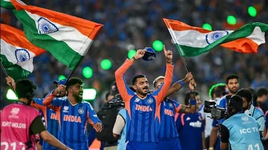Indian cricket team celebrating with flags after victory