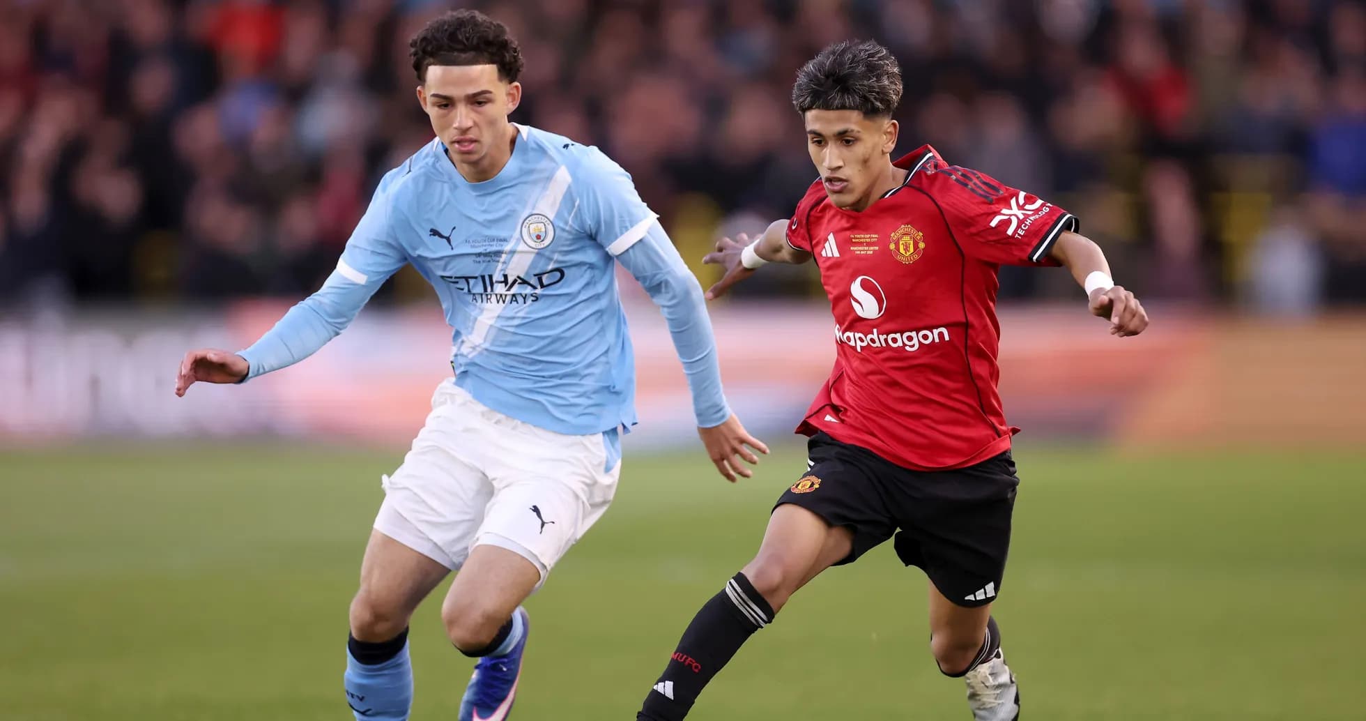 Two players competing for the ball during match
