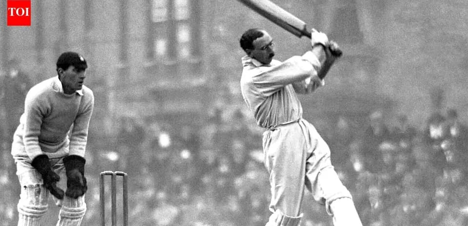 Batsman playing a shot with wicketkeeper behind