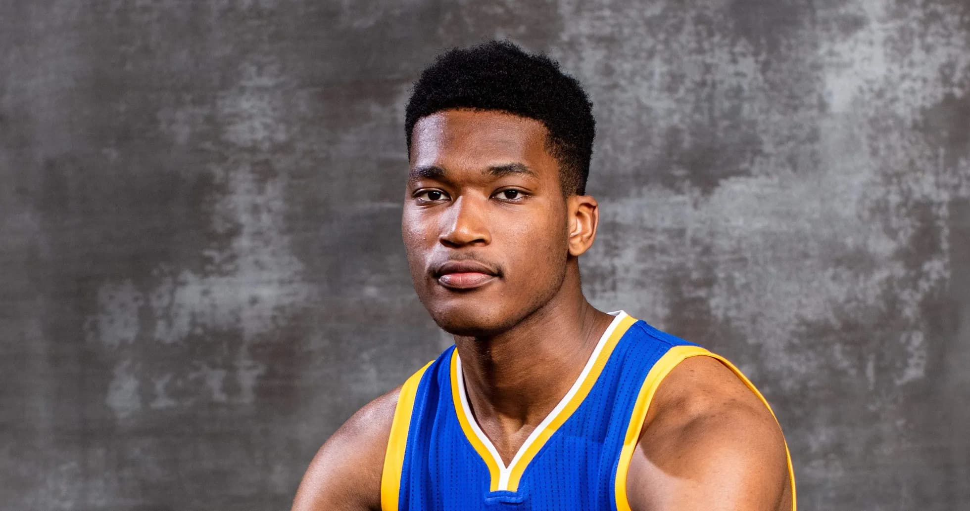Basketball player posing in blue jersey