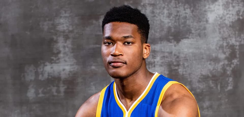 Basketball player posing in blue jersey