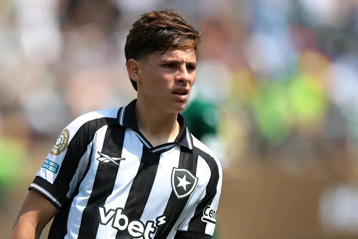 Player in black and white striped jersey on field