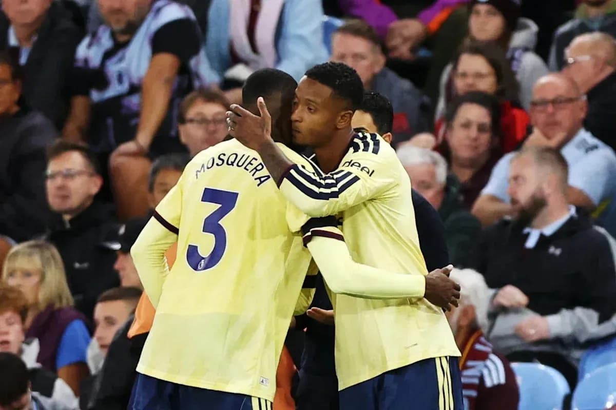 Players embracing on the sidelines during match