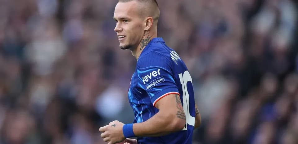 Player wearing blue jersey during match action