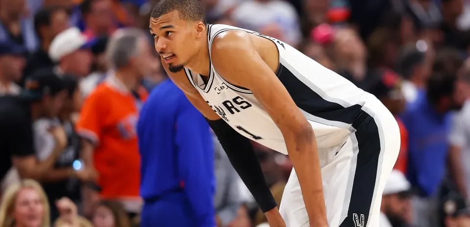 Player in Spurs jersey during basketball game