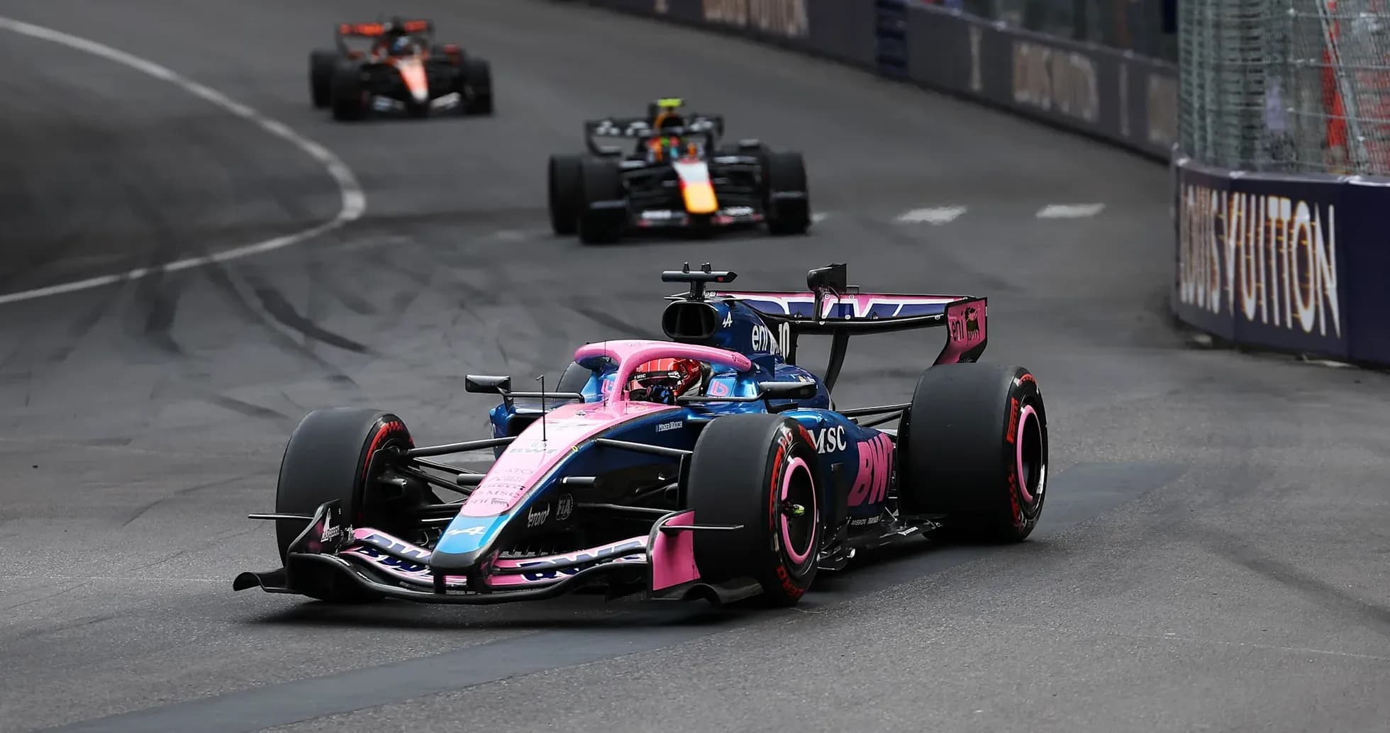 F1 car racing on street circuit during competition