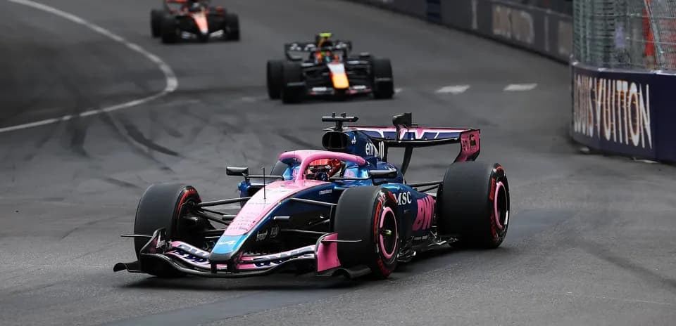 F1 car racing on street circuit during competition