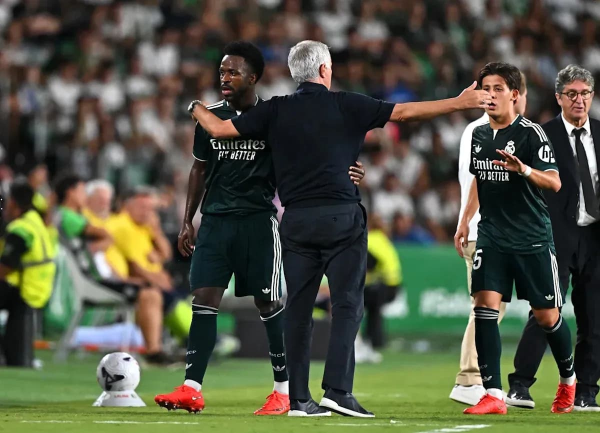 Coach speaking to players during match substitution