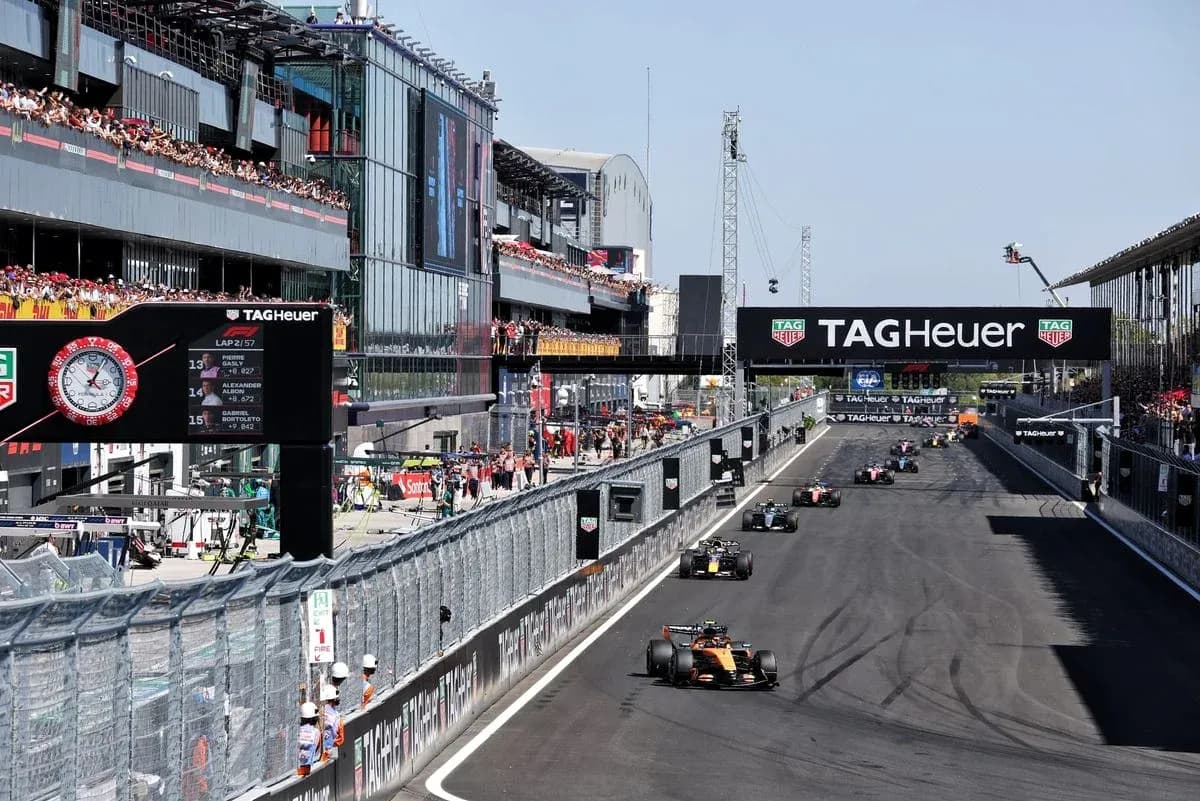Formula 1 cars racing at the circuit during event