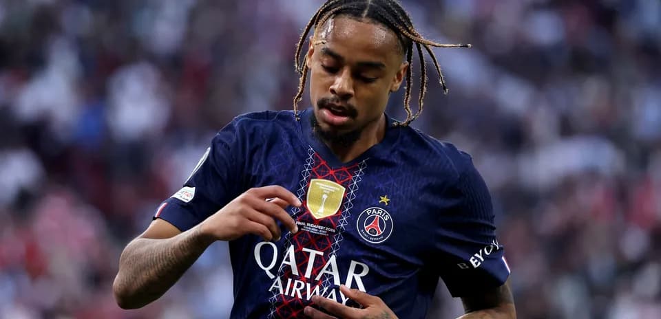 Player adjusting jersey with Qatar Airways logo