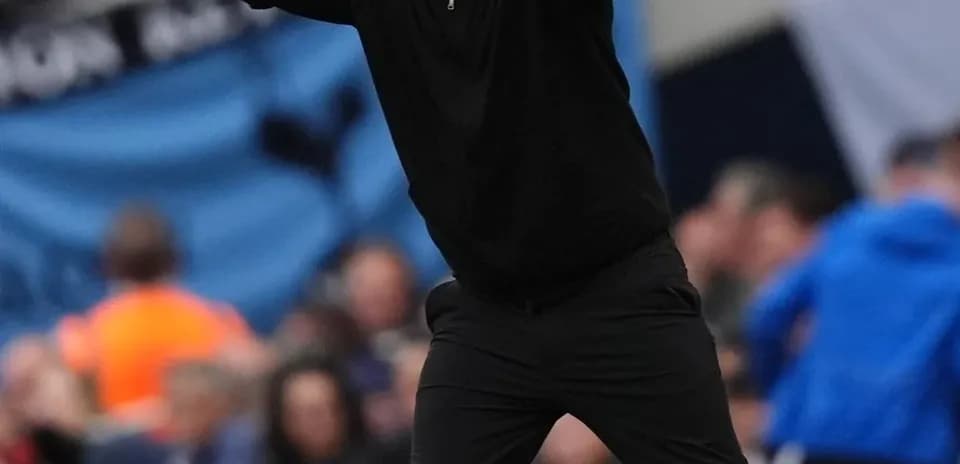 Coach gesturing during match from sideline