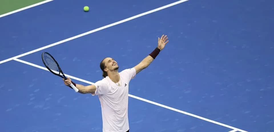 Player celebrating a point during tennis match