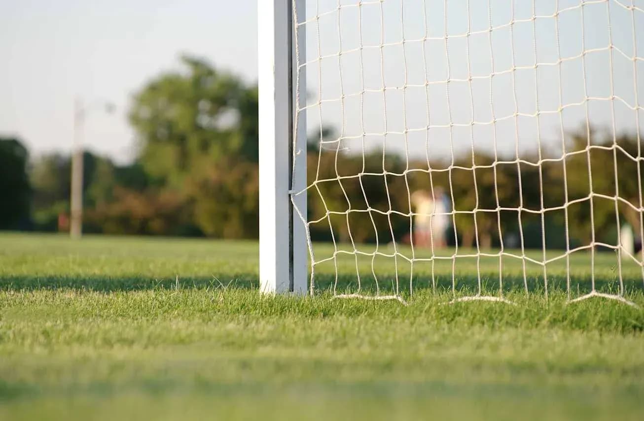 Close-up of a soccer goal net on field