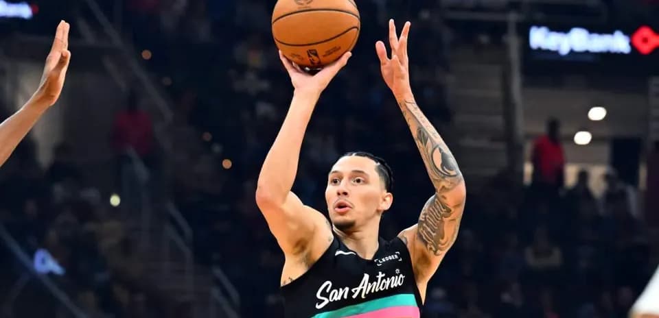 Player shooting basketball during a game