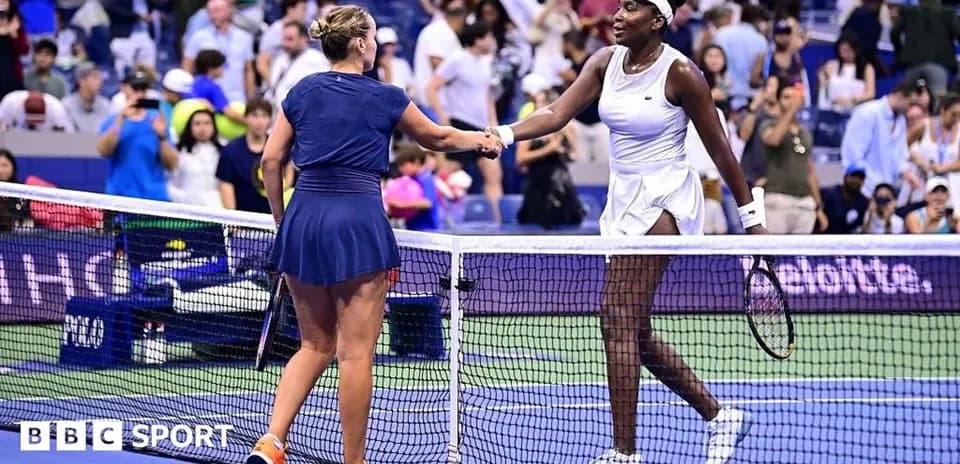 Two tennis players shaking hands at net