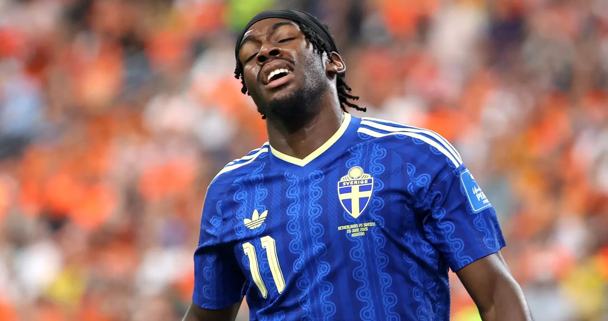 Player in blue Sweden jersey during match action