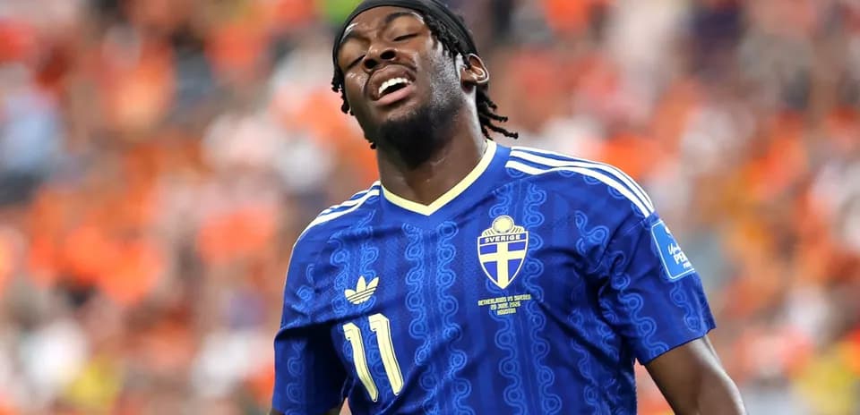 Player in blue Sweden jersey during match action