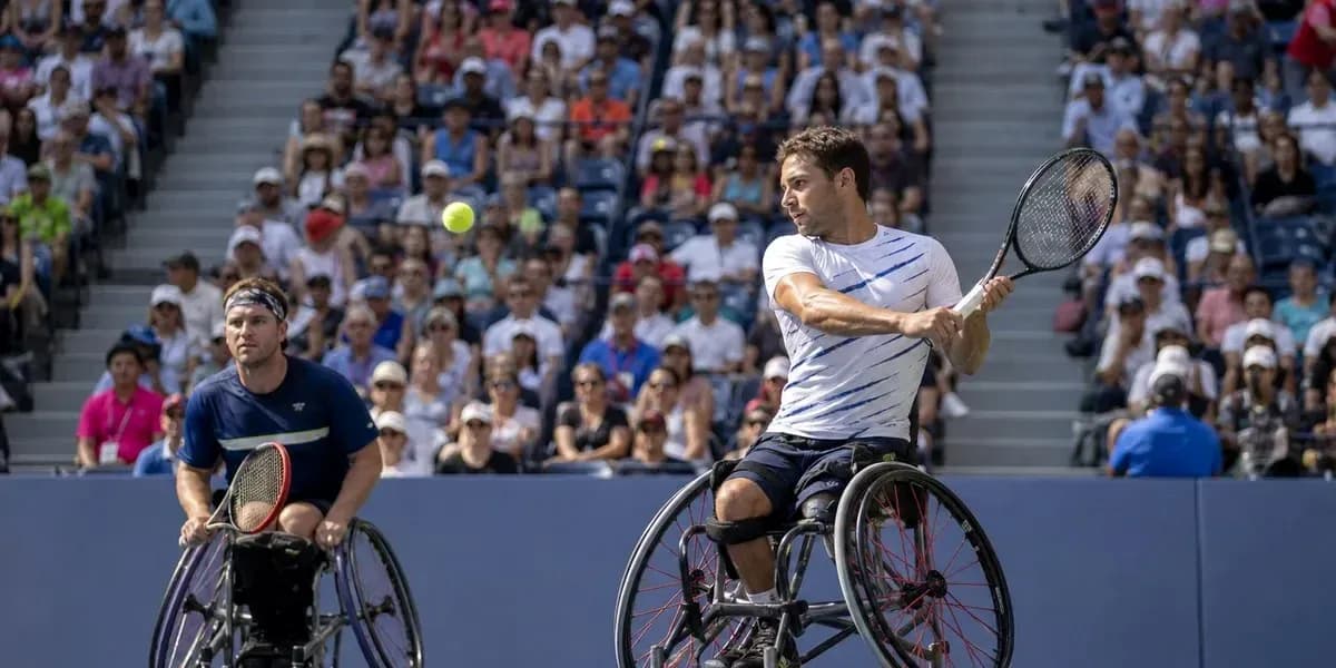 Two wheelchair tennis players competing in a match