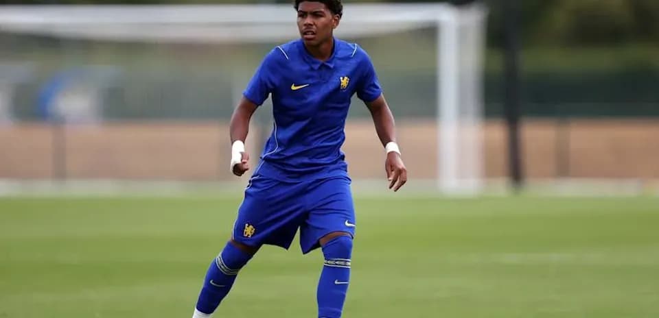 Player in blue kit training on the pitch