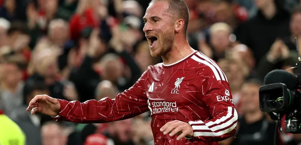 Player celebrating a goal for Liverpool at Anfield