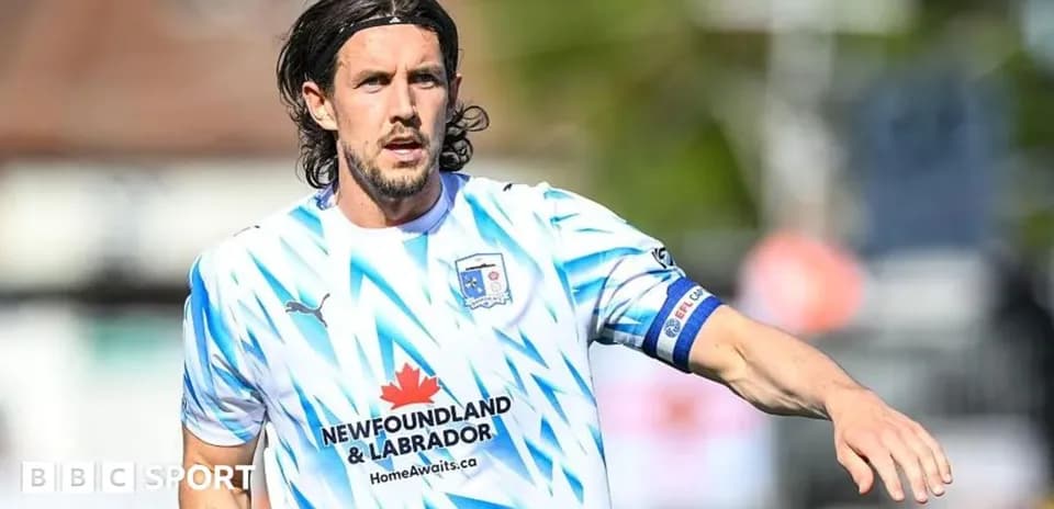 Player in blue and white jersey during match