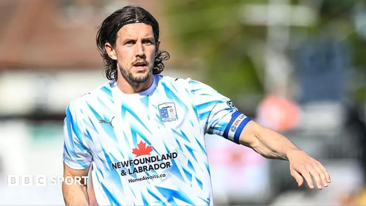 Player in blue and white jersey during match