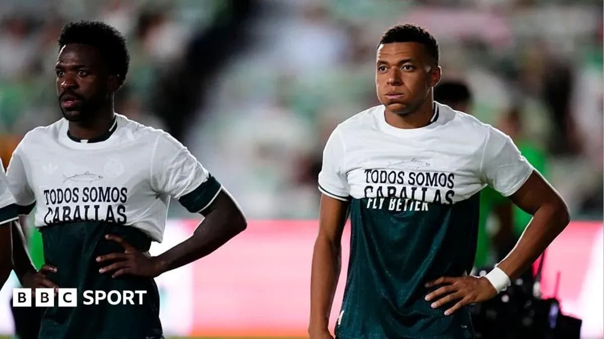 Two players wearing matching shirts before a match