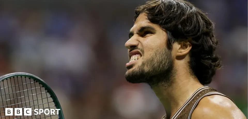 Tennis player showing intense expression on court