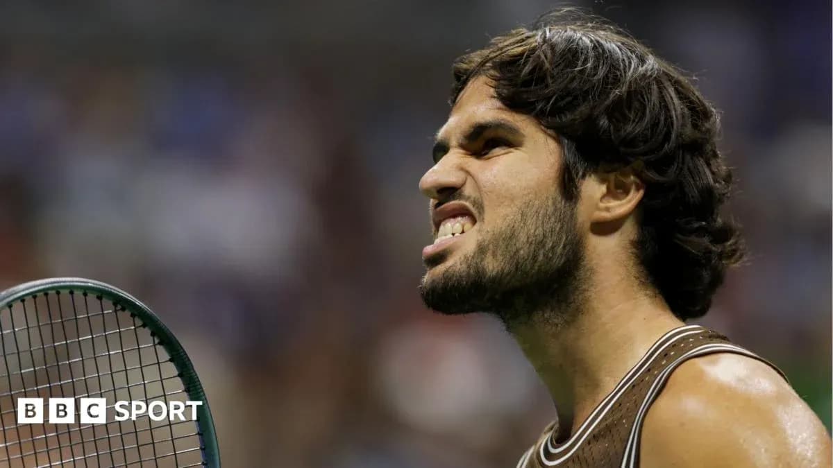 Tennis player showing intense expression on court