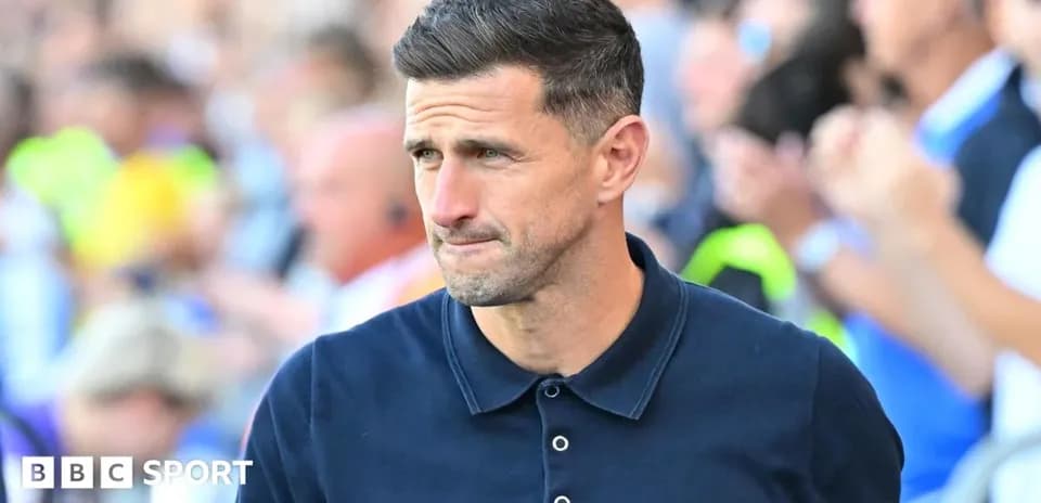 Coach walking on the sideline during a match