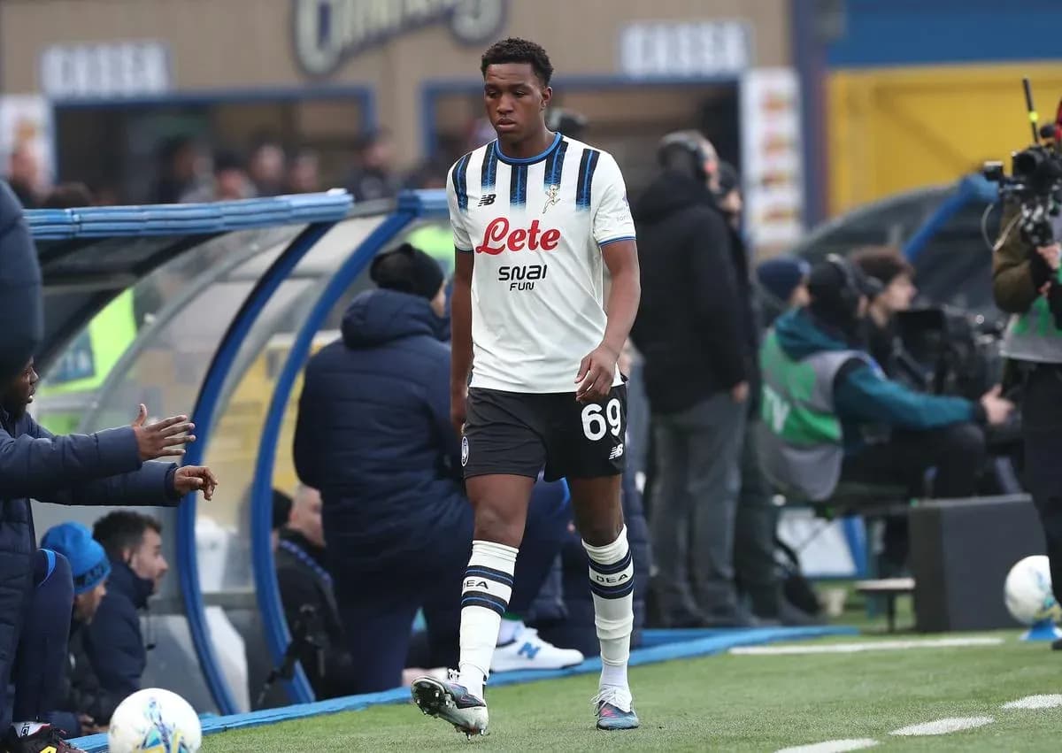 Player walking past bench during match substitution