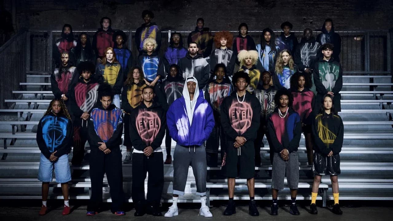 Group of young models in colorful hoodies posing