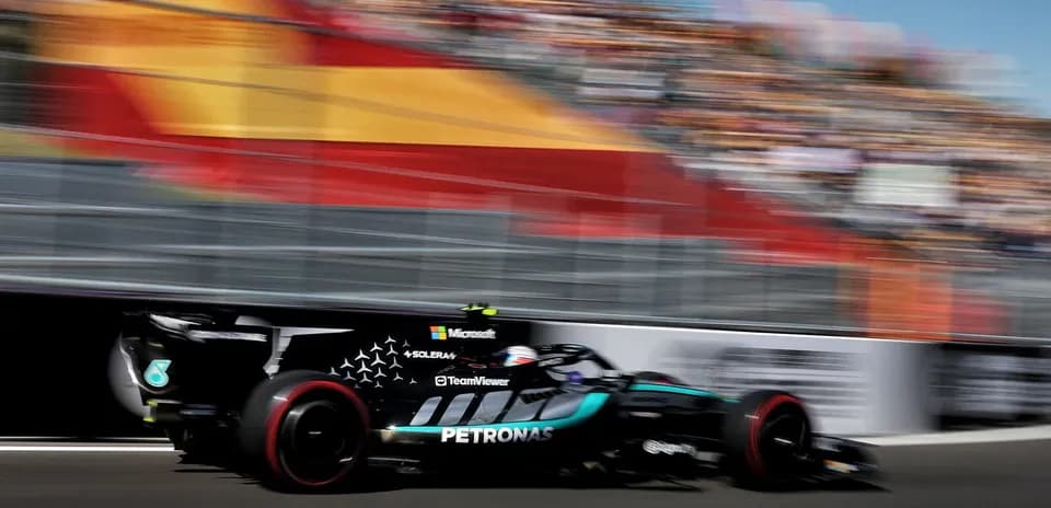 Formula 1 car racing past with blurred background