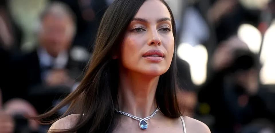 Woman in elegant attire with jewelry at event