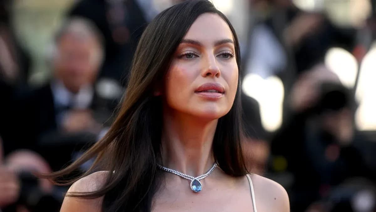Woman in elegant attire with jewelry at event
