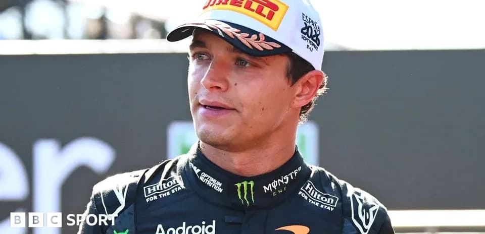 Driver speaking after race wearing McLaren team uniform