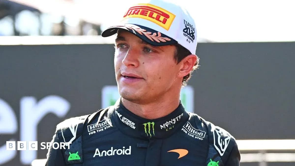 Driver speaking after race wearing McLaren team uniform