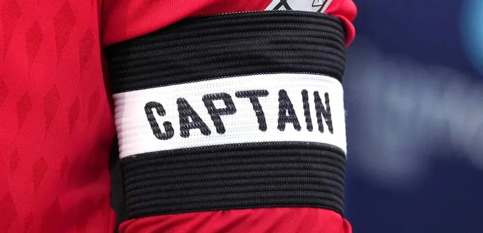 Close-up of captain's armband with 'CAPTAIN' label