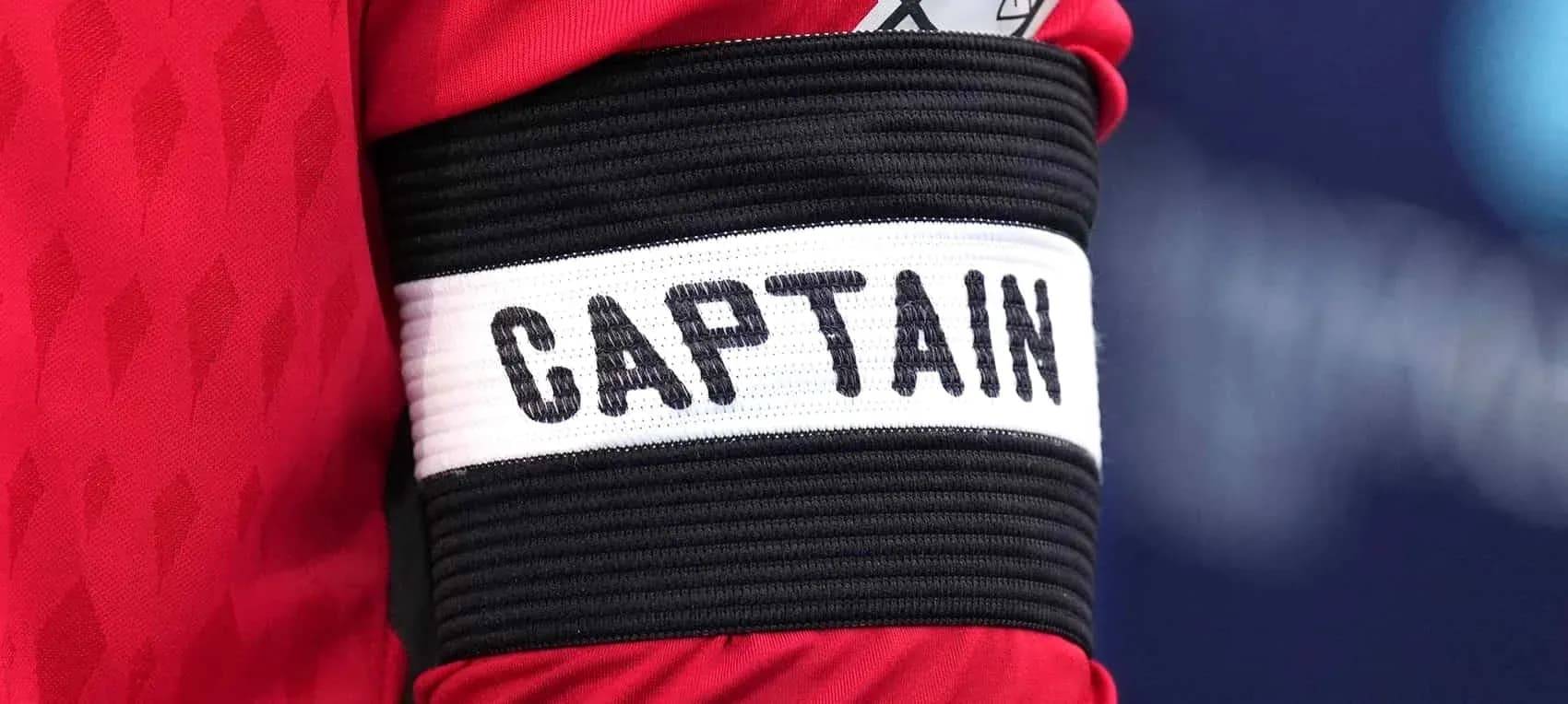Close-up of captain's armband with 'CAPTAIN' label