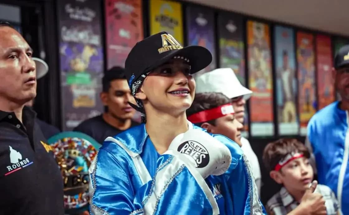 Boxer smiling in preparation with team members
