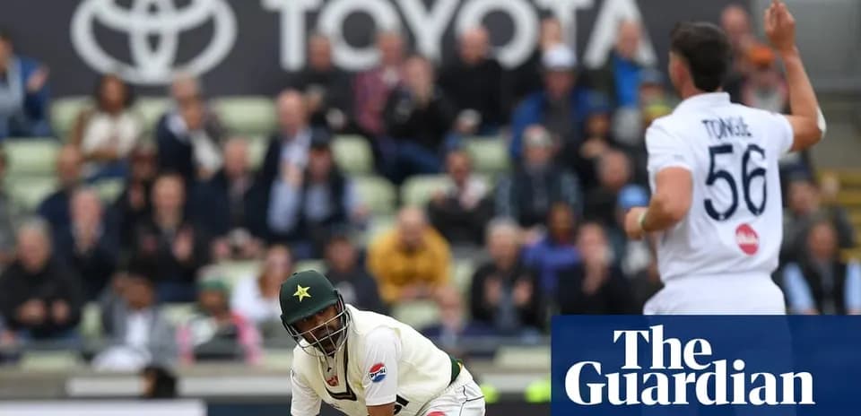 Cricketer in action during match with spectators in background